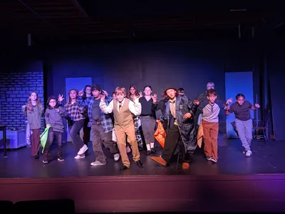 The company of Oliver! The Musical in a full stage number