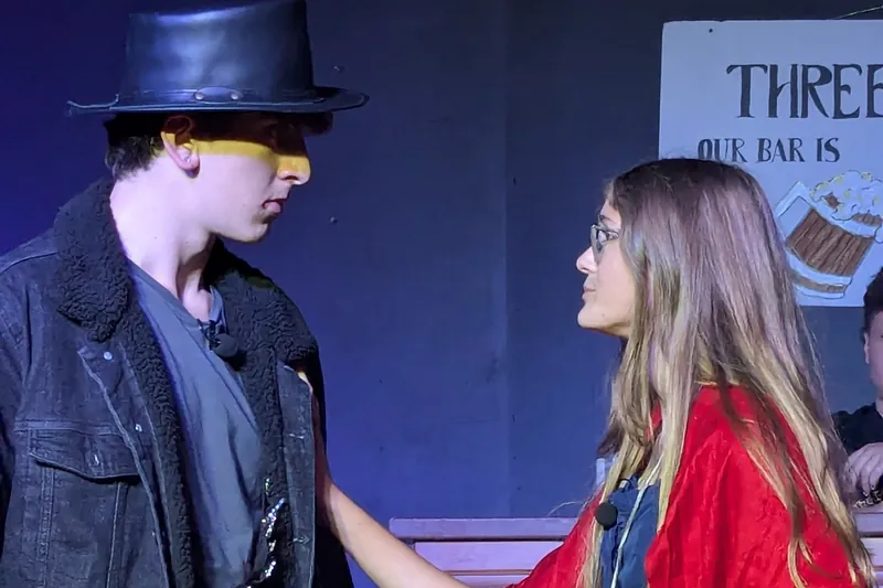 Two young actors playing a scene from Oliver! The Musical