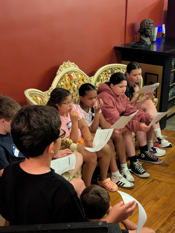Students reading through their scripts together